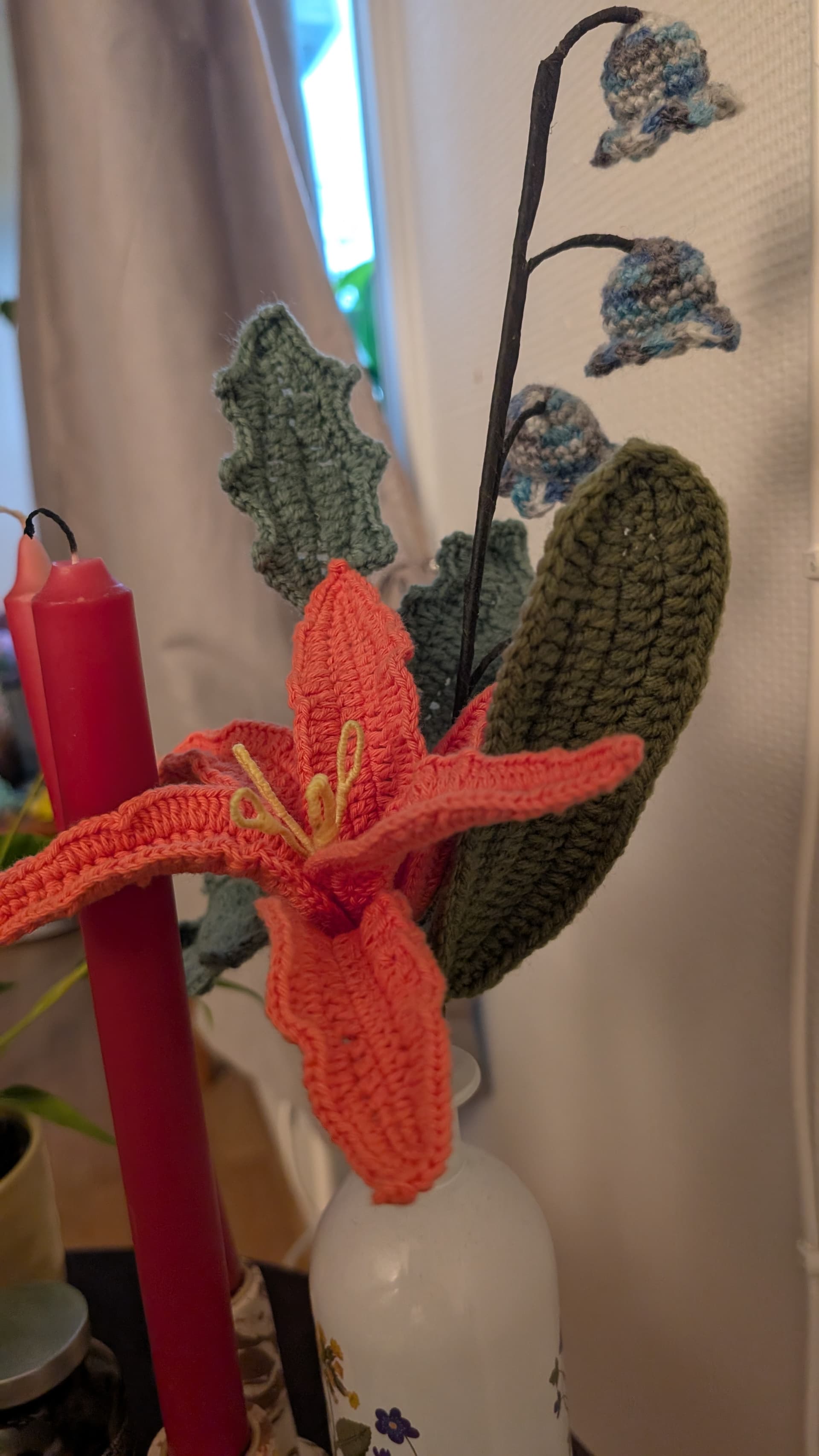 A close view of crocheted petals and leaves