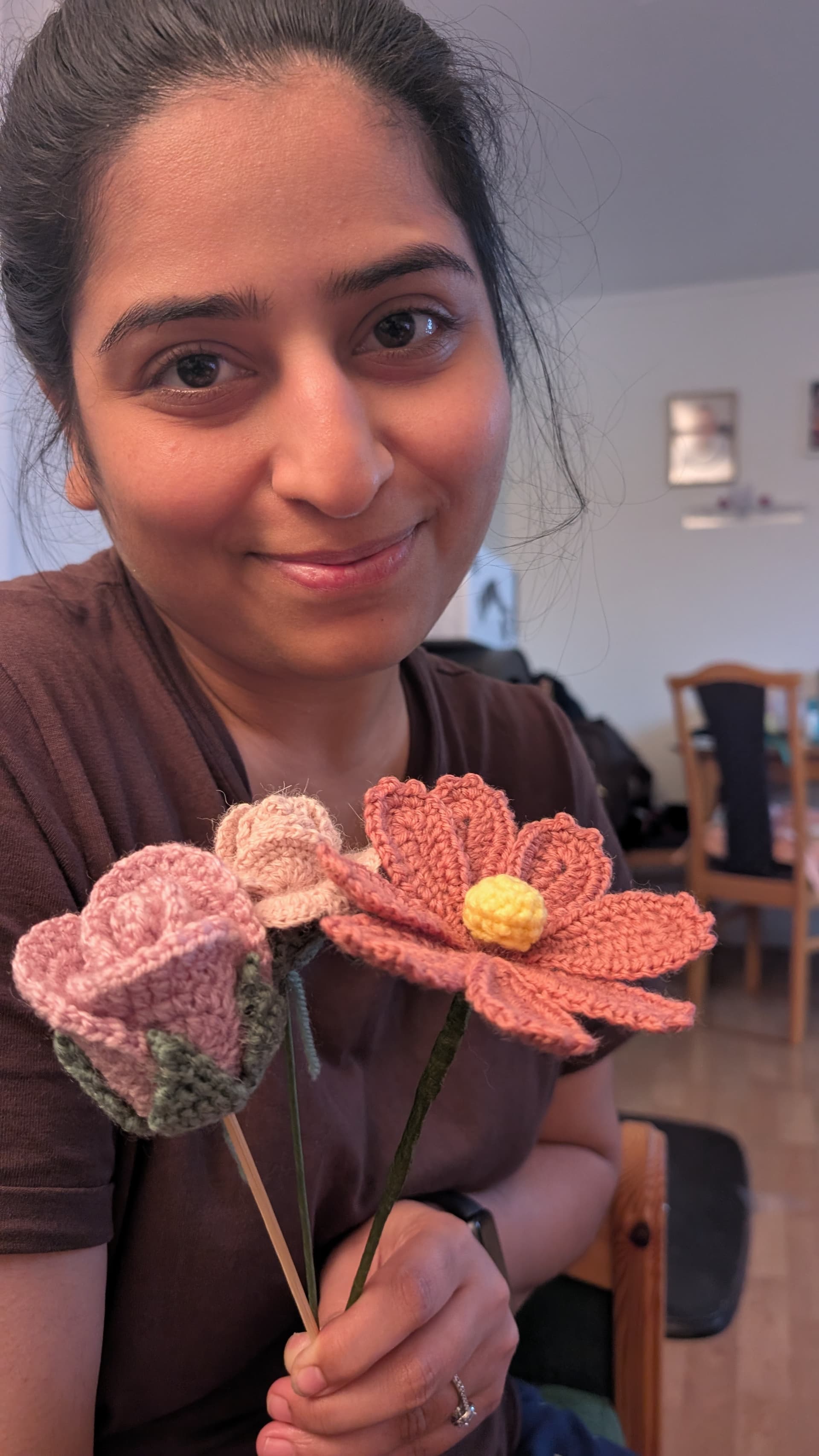 Prerna Nanwani holding crocheted flowers
